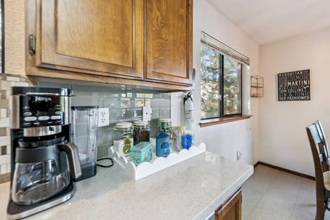Bright coffee station with drip maker and essentials for easy Tahoe morning brews.