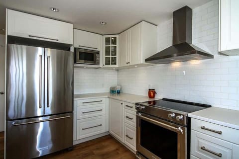 Kitchen is modern with all new luxury appliances