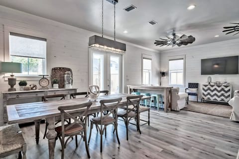 Enjoy seamless indoor-outdoor dining with a view of the pool.