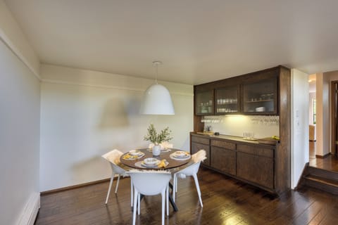 Stylish dining nook with modern seating and a built-in bar for effortless entertaining.