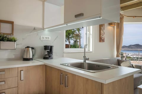 Prepare Your Meals in Style in Our Modern Kitchen, Offering a Refreshing Sea View as the Perfect Backdrop.