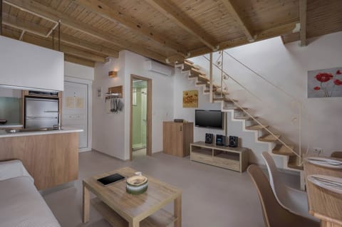 Whether you prefer a good book, TV, or music, our living area is equipped for your enjoyment. Unwind with a book or indulge in the latest shows and music using our sound system.