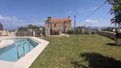 Relish carefree moments on the poolside grass, creating a perfect spot for relaxation and leisure.