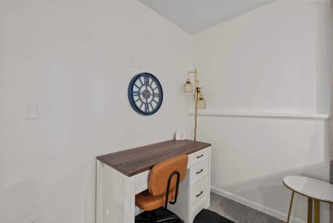 Catch up on emails or enjoy a book at the living room’s desk workspace