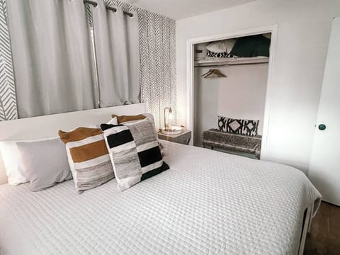 Primary bedroom with king bed and smart TV