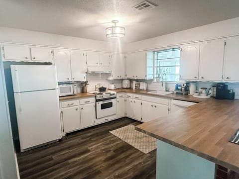 Fully stocked kitchen with all essentials, keurig coffee station, and basic cooking spices and oil