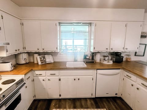 Fully stocked kitchen with all essentials, keurig coffee station, and basic cooking spices and oil