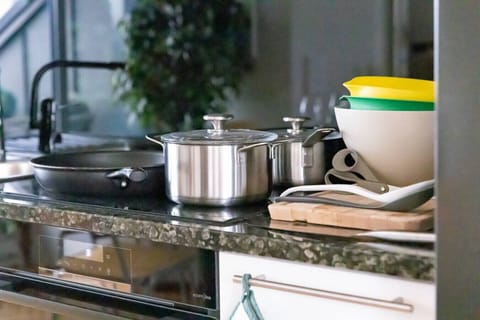 Modern, fully stocked kitchen featuring quality cookware, dining ware, and everything you need for a comfortable stay.