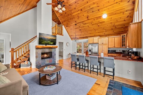 Fireplace view from the kitchen bar. Central spot for gathering.