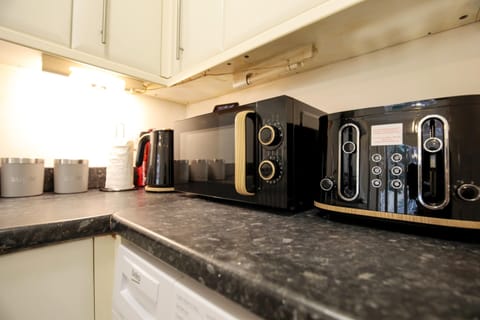 Kitchen has Microwave, Kettle and Toaster.