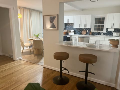 Dining counter leading to full kitchen. Seating for 6.