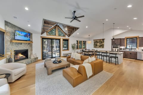 Large great room with seating for everyone by the fireplace.