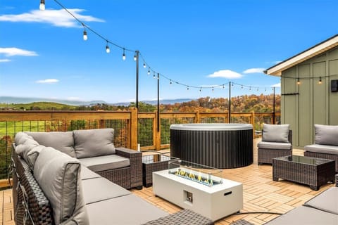 Skyline Chalet's firepit and hot tub area