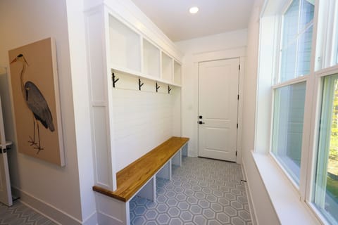 Mudroom with coat and towel hangers and cubby storage