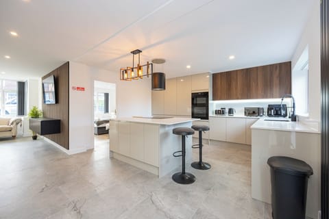 Kitchen with washer, dryer, freezer, fridge, induction hob, dish washer