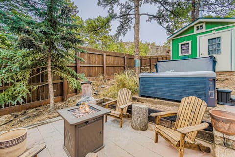 Gather around the fire pit in this private outdoor oasis — complete with Adirondack chairs and pine views.