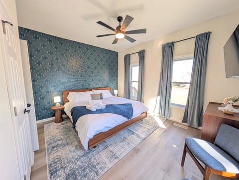 Enjoy this spacious king-sized bedroom complete with smart TV, ceiling fan and ensuite bathroom