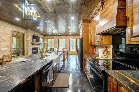 Chic farmhouse kitchen fully equipped for gourmet meals, featuring a filtered water spout