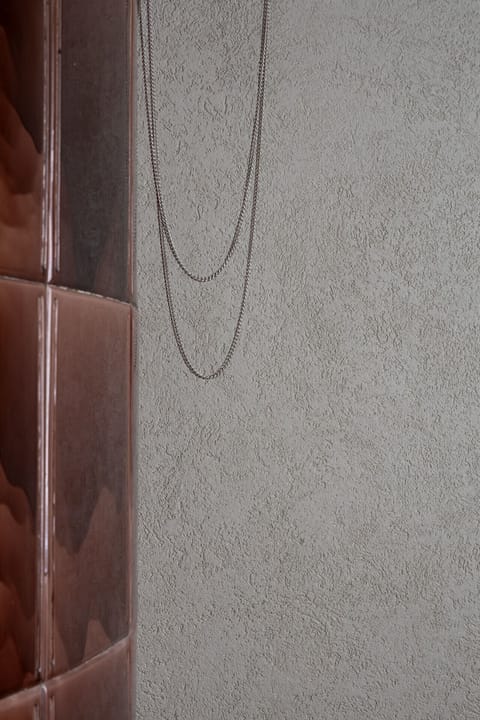 Sleek surfaces, modern lighting, and stylish furnishings create a fresh, design-forward atmosphere throughout the home.