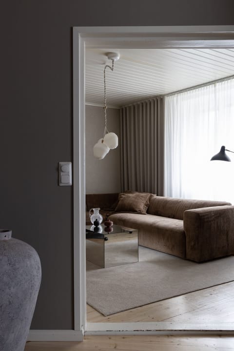 Soft fabrics and deep cushions make this corner sofa ideal for lounging.