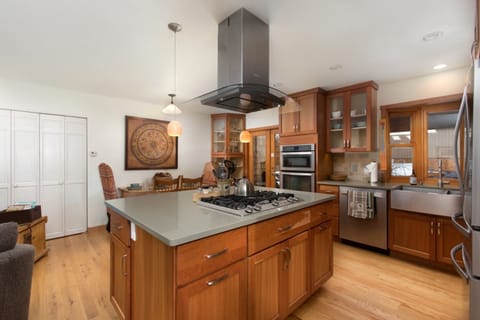 Gas Stove and View of Large Well Stocked Kitchen
