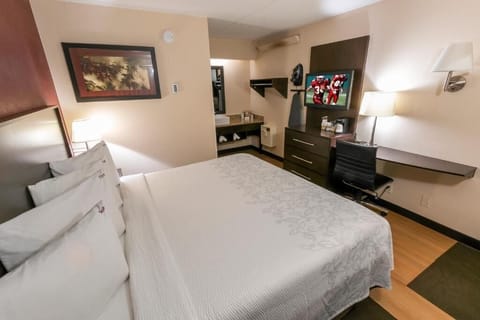 Recharge in a simple, comfortable room designed for deep sleep.