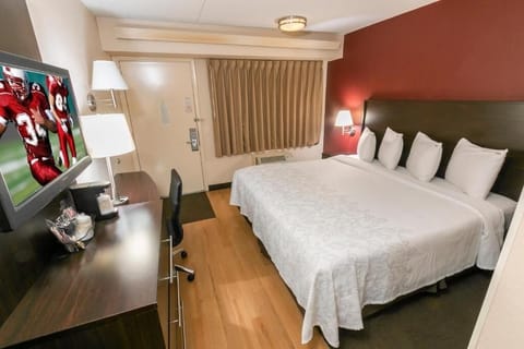 Relax into a restful night with soft bedding and blackout drapes.