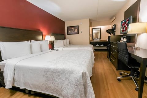 Unwind in bright double beds with cozy, hotel-fresh linens.