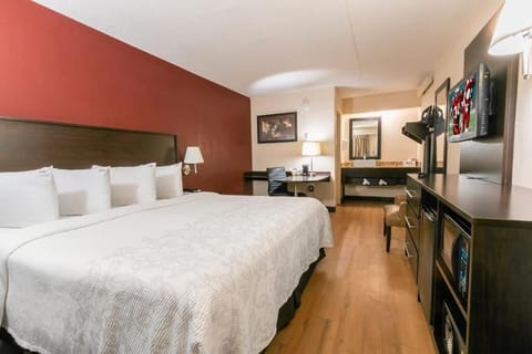 Stretch out and relax with plush bedding and warm lighting.