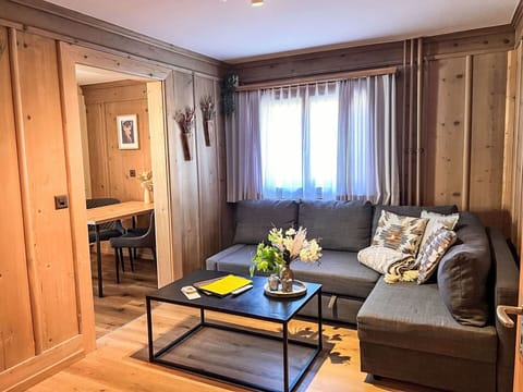 Furniture, Wood, Flooring, Interior Design, Floor, Room, Lighting, Living Room, Apartment, Couch