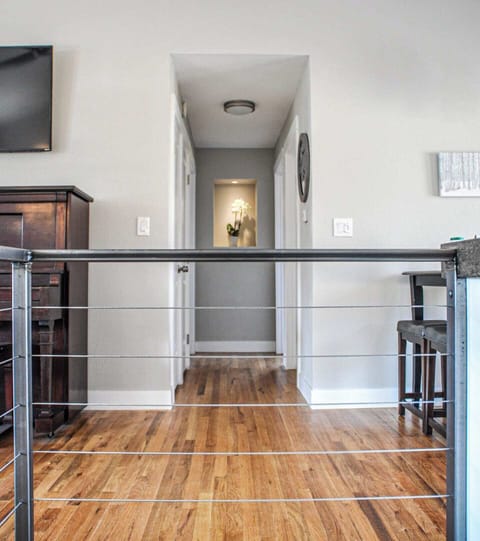 Looking down hall through cable railing