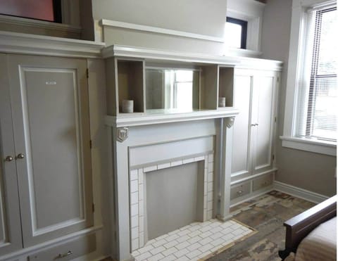 This is the built in cabinet.  Note the bed on the left.  Since the house was built in 1900 each room downstairs had it's own fireplace for heat.