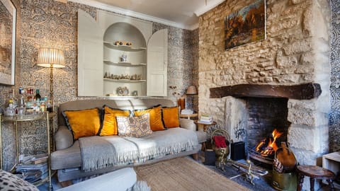 Warm and welcoming, the sitting room invites you to sit down, take a break, and relax a while.