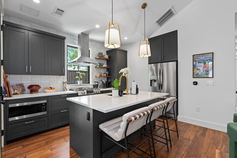 Sleek kitchen setup with a roomy island perfect for meals and prep.