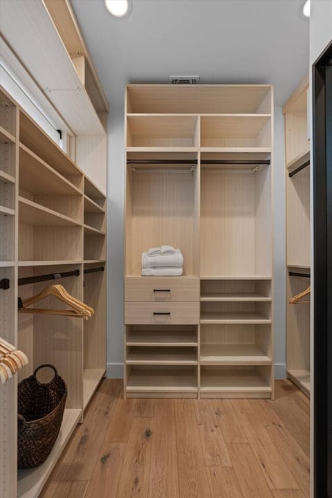 Spacious walk-in closet with plenty of room to organize your belongings.