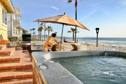 Sink into plush seating, sip at the outdoor bar, or unwind in the hot tub as the sun melts into the Pacific. The deck is the heart of this home , steps from the sand, made for golden-hour magic.