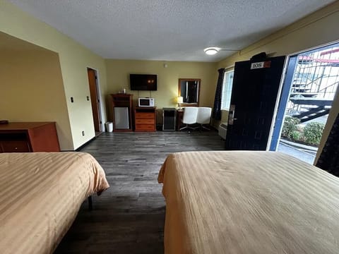 Kick back with TV, mini-fridge, and an easy work spot.