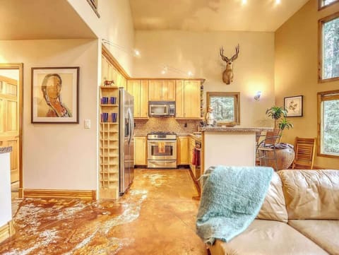 Our inviting family room has an open kitchen space, where modern comfort meets cozy charm.