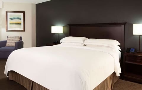 Drift off fast in a serene bed with soft lighting.