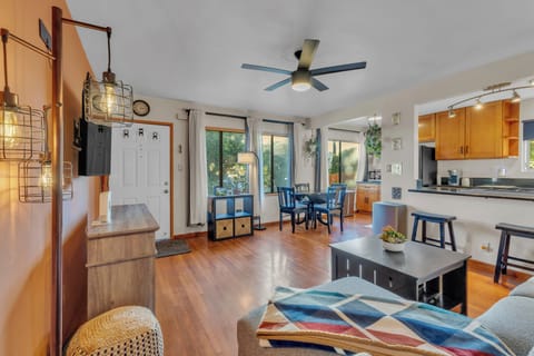 2 bed/1 bath with abundant natural light, hardwood floors, and natural plants.