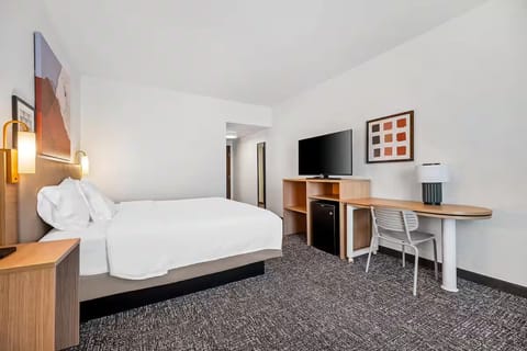 Settle in with a large TV and handy work desk.