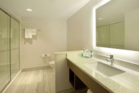 Clean bathroom with wide vanity and walk-in glass shower
