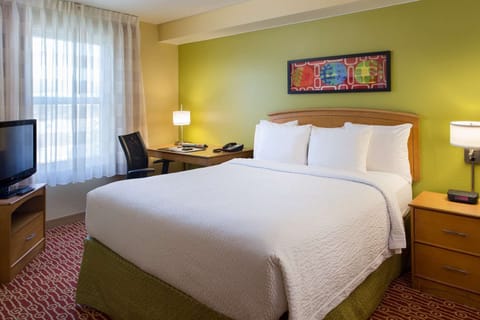 Unwind in crisp linens and soft light after exploring.