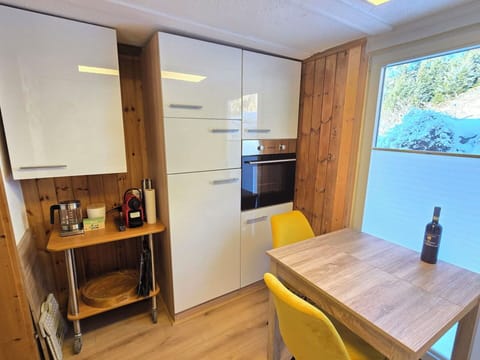 Furniture, Flooring, Interior Design, Floor, Wood, Countertop, Cabinetry, Wood Flooring, Kitchen, Room