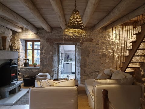 Comfortable seating area with access to separate kitchen