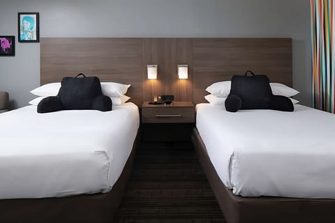 Settle into crisp double beds for effortless, restful sleep.