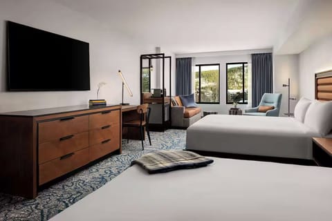 Unwind with lounge seating, big TV, and airy comfort.