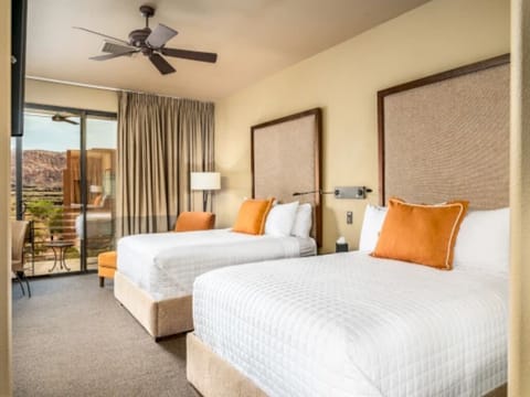 Unwind in bright double beds with stunning balcony views.
