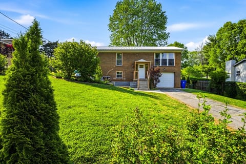 Classic Brick Front | Elevated Entry & Attached Garage | Lush Green Yard