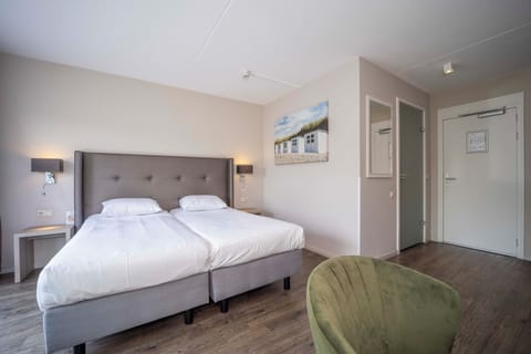 Stretch out in a bright, modern room with plush bedding.